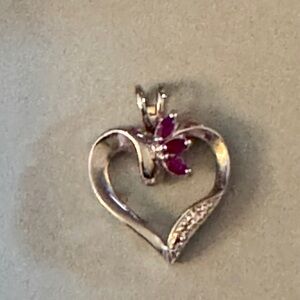 💕Ruby and Diamond accents. On 925 Sterling silver heart with three ruby stones.